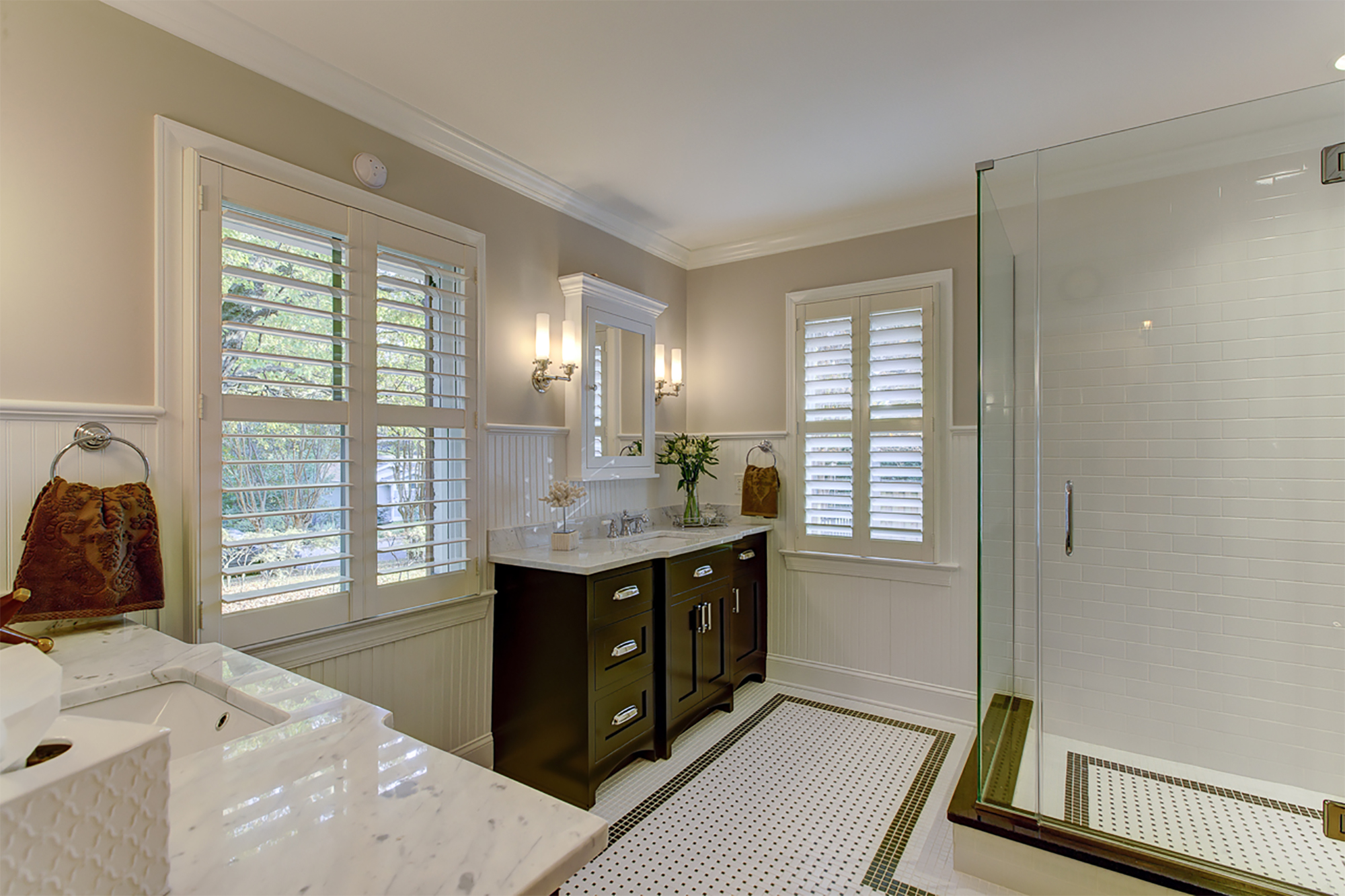 bathroom remodel with white floor tile and glass shower door