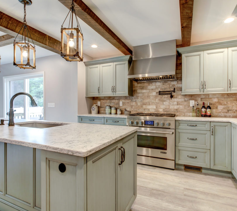 modern kitchen with aqua cabinets and wood floors