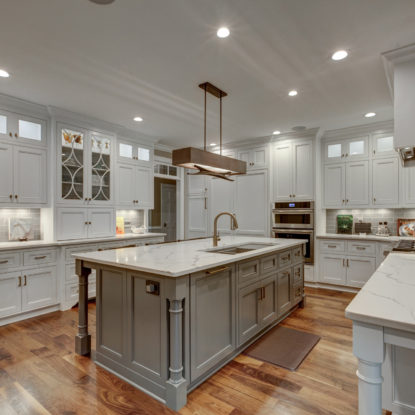 kitchen remodel with marble countertops and white cabinets