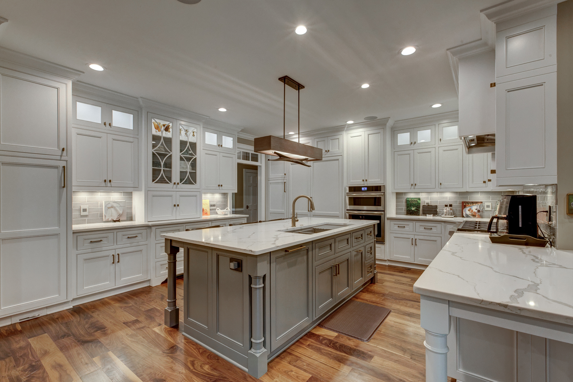 kitchen remodel with marble countertops and white cabinets