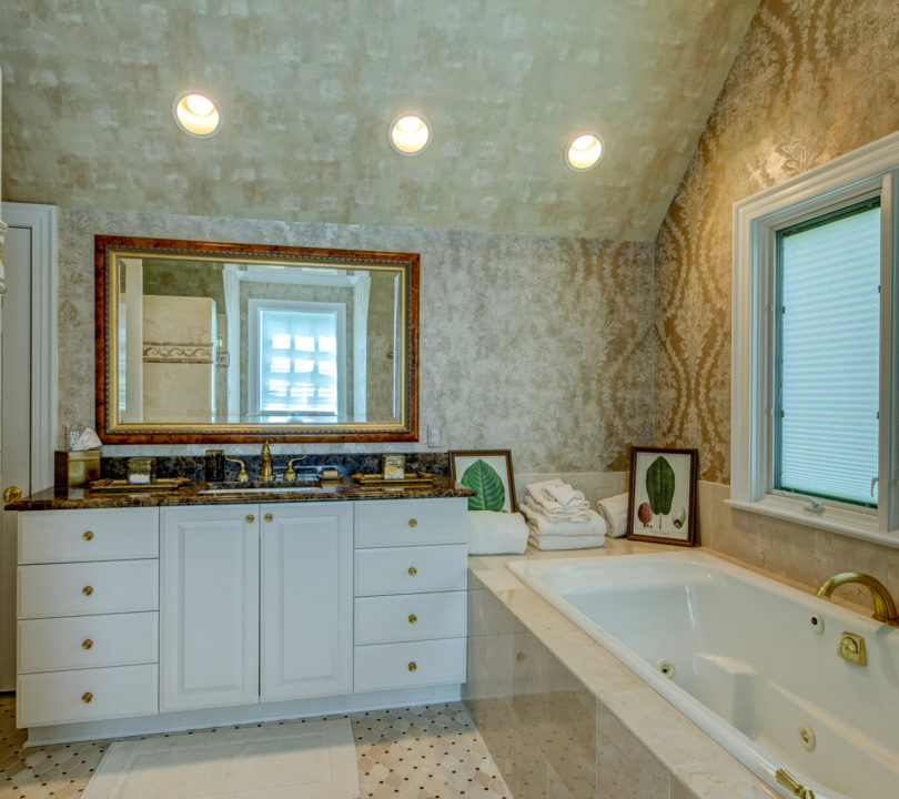 luxury bathroom remodel with gold and beige colors